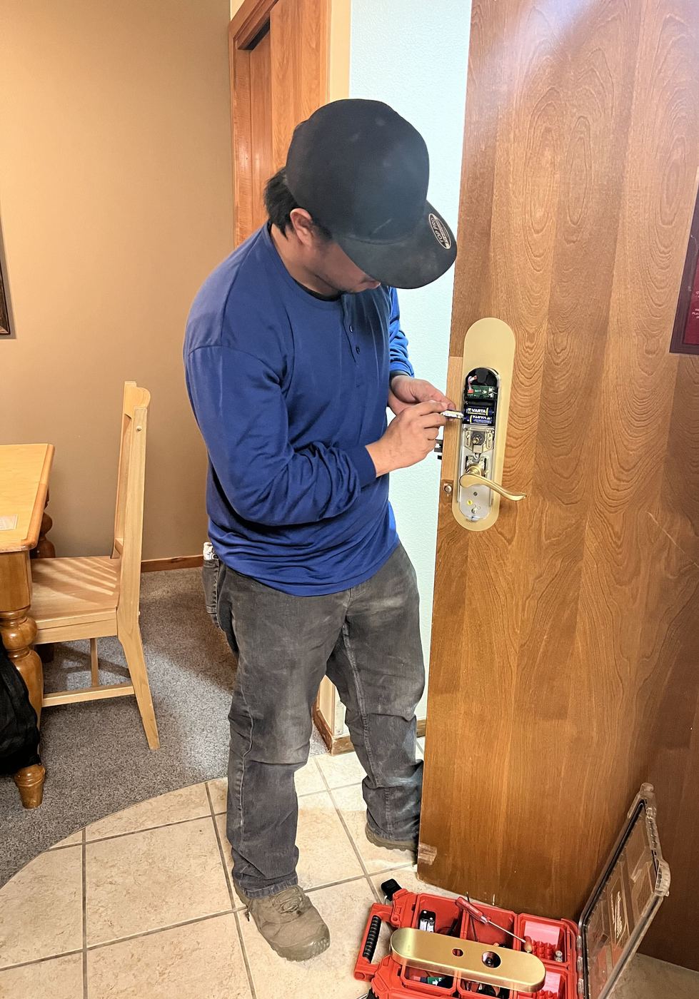Technician working on the battery pack and internals of a SALTO XS4 electronic lock